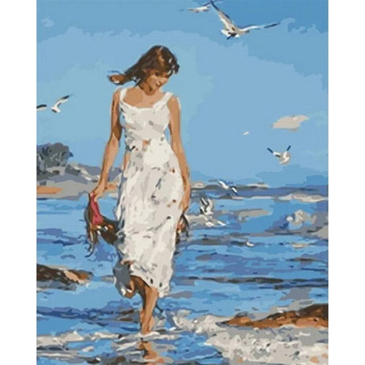 Woman walking by the Sea