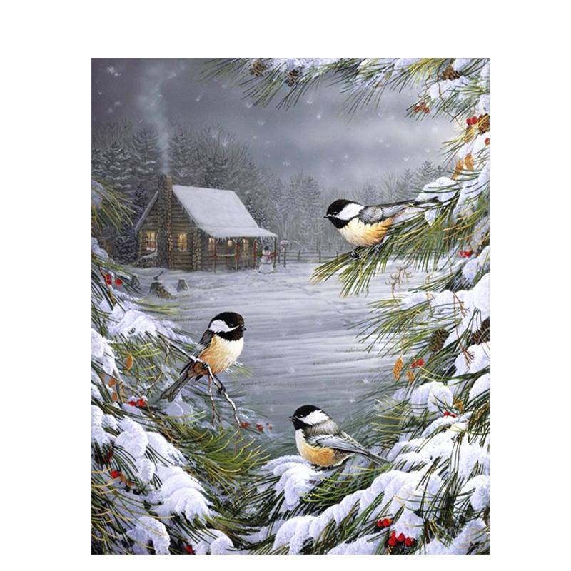 Vögel im Schnee auf einem Baum