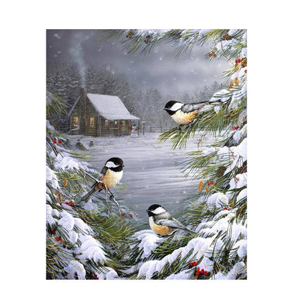 Vögel im Schnee auf einem Baum