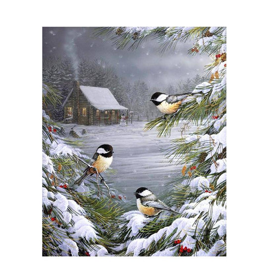 Vögel im Schnee auf einem Baum