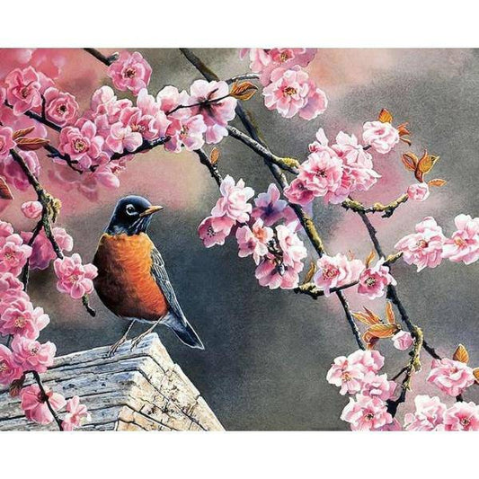 Kleiner Vogel vor rosa Blumen