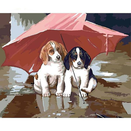 Zwei Welpen unter einem Regenschirm